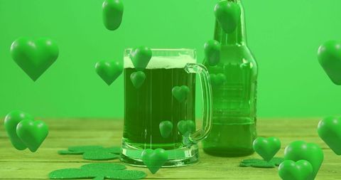 Green beer mug and bottle with floating 3d hearts and shamrocks for st. Patrick's day