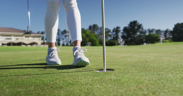 Golfer Approaching Hole on Sunny Day - Download Free Stock Images Pikwizard.com