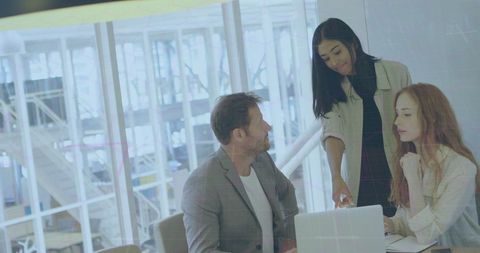 Business Team Collaborating During Meeting in Modern Office