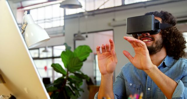 Man Experiencing Virtual Reality with VR Headset in Modern Office - Download Free Stock Images Pikwizard.com