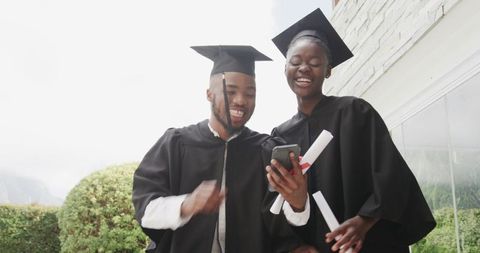 Joyful Graduates Celebrating Success Together Outdoors