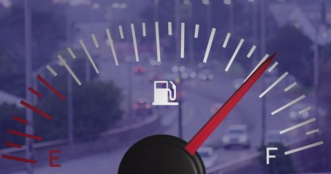 Fuel Gauge Overlay on Busy Highway Background