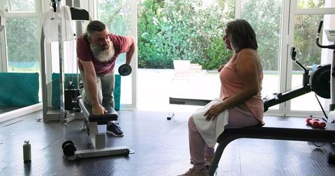 Senior Couple Enjoying Fitness Routine in Home Gym Setting