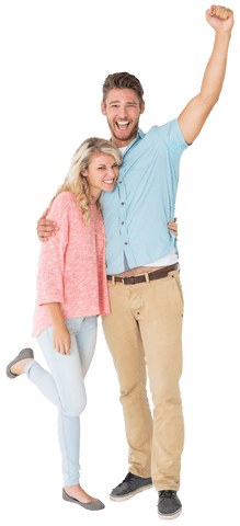 Cheerful couple celebrating standing with arm raised