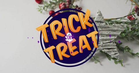 Halloween decoration with trick or treat sign and festive ornaments