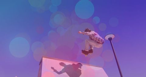 Man Skateboarding with Vibrant Bokeh Lighting - Download Free Stock Images Pikwizard.com