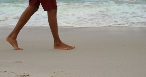 Barefoot Walking by Ocean Shoreline