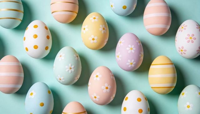 Displaying pastel Easter eggs with daisy motifs on mint backdrop in orderly grid