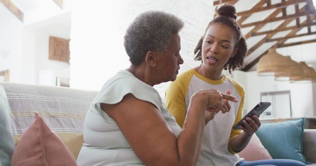 Mother and Daughter Sharing Moment Using Smartphone at Home - Download Free Stock Images Pikwizard.com