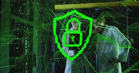 IT Researchers Studying Cybersecurity Shield Hologram Over Server Racks in Data Center Lab