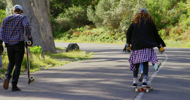 Teenagers Longboarding and Skateboarding on Rural Road - Download Free Stock Images Pikwizard.com