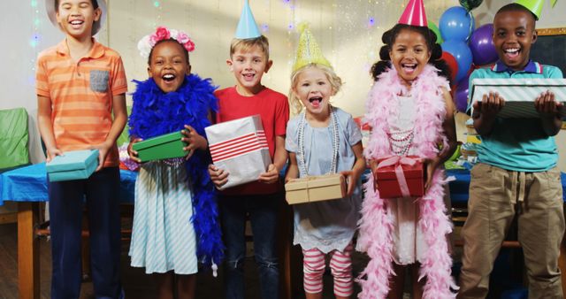 Joyful Children Celebrating Birthday Party with Gifts and Party Hats - Download Free Stock Images Pikwizard.com