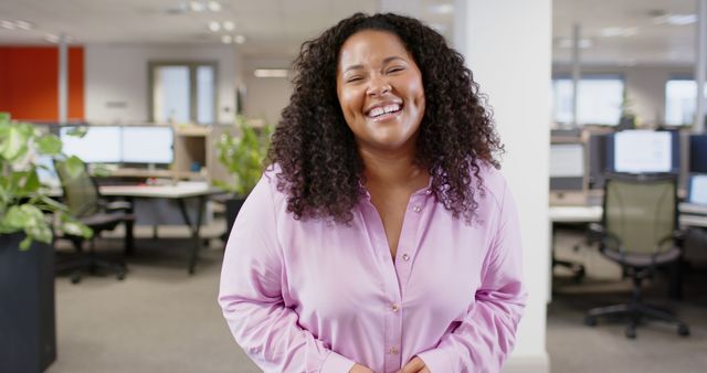 Confident African American Woman Smiling in Office Environment - Download Free Stock Images Pikwizard.com