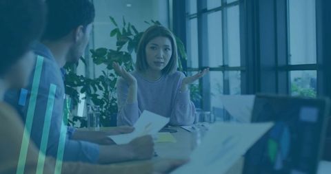 Asian Businesswoman Leading Meeting in Modern Office