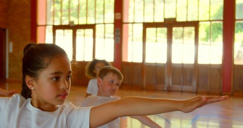 Diverse Group of Schoolkids Practicing Yoga at School