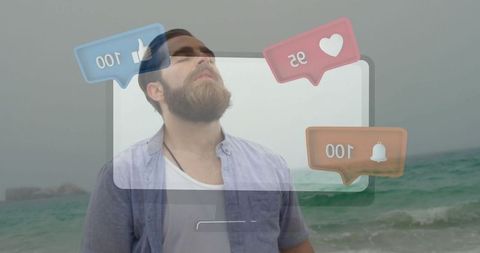 Bearded Man Enjoying Shoreline with Digital Notifications