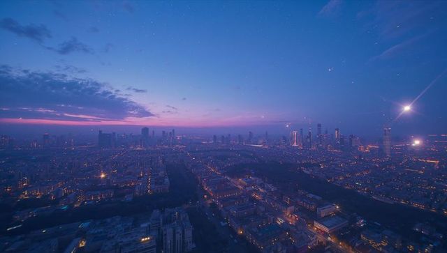 Aerial Cityscape at Twilight with Illuminated Skyline