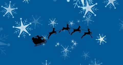 Santa sleigh silhouette in winter wonderland sky with reindeer