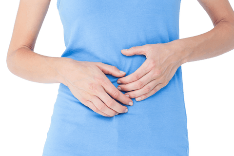 Woman Holding Stomach in Transparent Blue Shirt