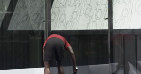 Male athlete practicing on indoor squash court