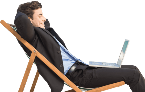Relaxed businessman using laptop while leaning back on transparent background