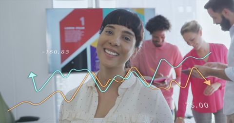 Diverse Team Working Through Analytics Data in Modern Office