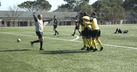 Soccer team celebrating victory highlighting sportsmanship