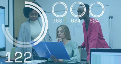 Business women collaborating over blue folder with data overlays and analytics dashboard