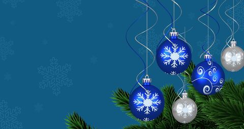 Festive Blue and Silver Christmas Baubles on Tree
