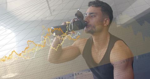 Athletic man drinking from reusable bottle after workout on bench with financial chart overlay