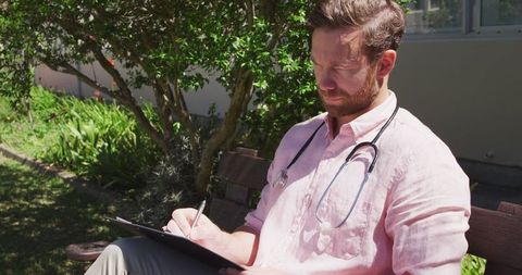 Doctor Analyzing Medical Results Outdoors Amid Covid-19