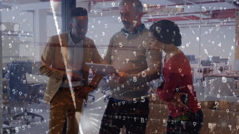 Diverse Business Team Analyzing Digital Data in Modern Office Environment