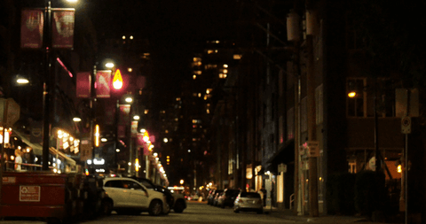 transparent nighttime city street scene with parked cars and lit windows - Download Free Stock Videos Pikwizard.com