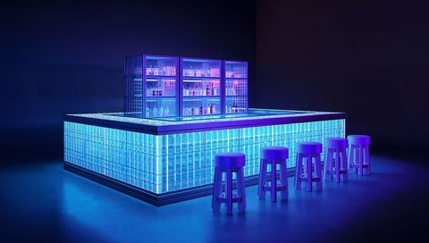 Glowing neon glass-block bar island radiating cyan and purple light with backlit shelving