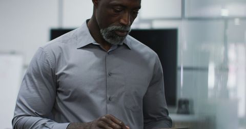 Business Professional Engaging with Digital Tablet in Modern Office