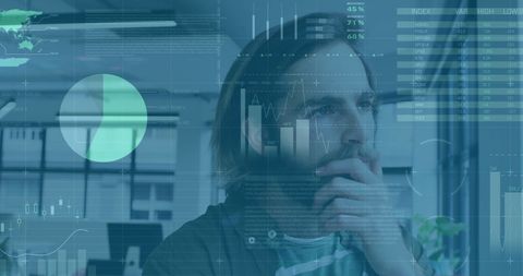 Businessman analyzing data projections in modern office environment