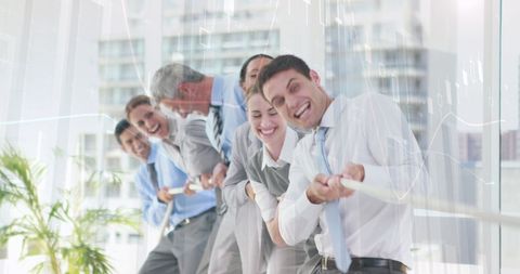 Diverse Coworkers Engaged in Office Tug of War Competition - Download Free Stock Images Pikwizard.com