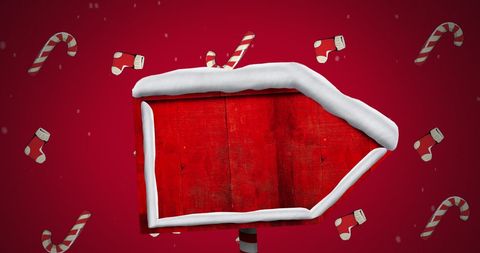 Festive red sign with snow and christmas candy canes on red background