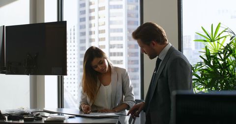 Professionals Reviewing Documents in Modern Office Environment - Download Free Stock Images Pikwizard.com