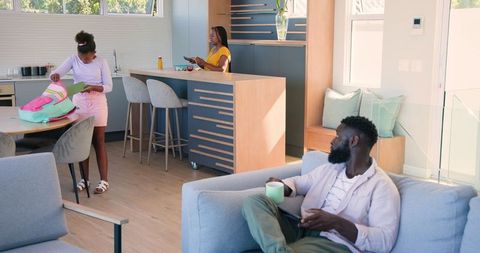 Morning Routine in Modern Family Home: Parents and Kid Prepping for Day