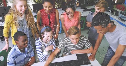 Diverse Students Collaborating on Mathematics with Laptop