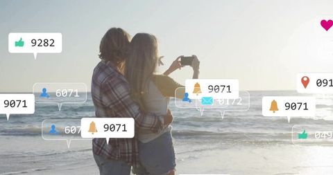 Romantic Couple Taking Selfie by Ocean at Sunset with Social Media Engagement