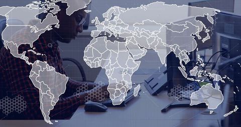 Focused Professional Working with Dual Monitors in Modern Office