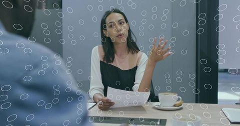 Professional Talk in Meeting Room with Documents and Coffee