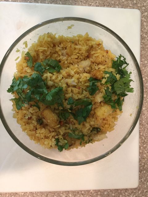 Aromatic Indian Vegetable Poha Dish in Glass Bowl with Cilantro Garnish - Download Free Stock Images Pikwizard.com