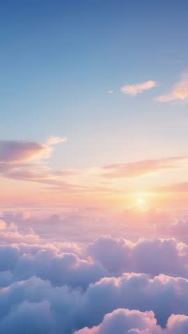 Vertical video: Sun rising over pastel cloudscape, casting golden dawn light