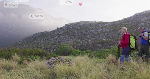 Couple on Mountain Hike with Gear and Backpacks, Outdoors Exploration