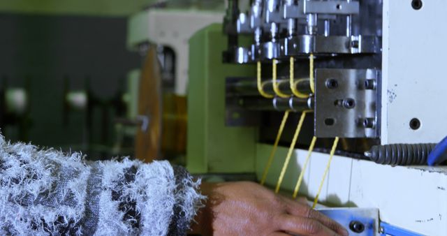 Close-Up of Worker Operating Industrial Machine in Textile Factory - Download Free Stock Images Pikwizard.com