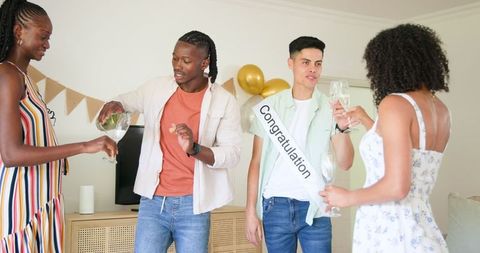 Friends Celebrating with Drinks at Home Party