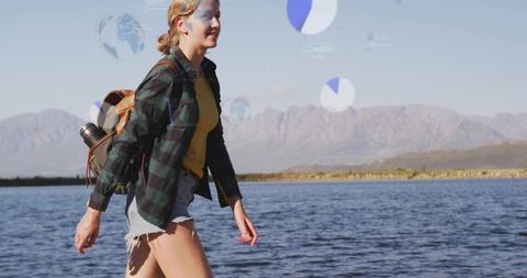 Woman Exploring Lakeside in Plaid, Colorful Adventurer Hiking
